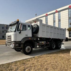 Sinotruk HOWO NX 6x4 tipper truck front left view with spare tire