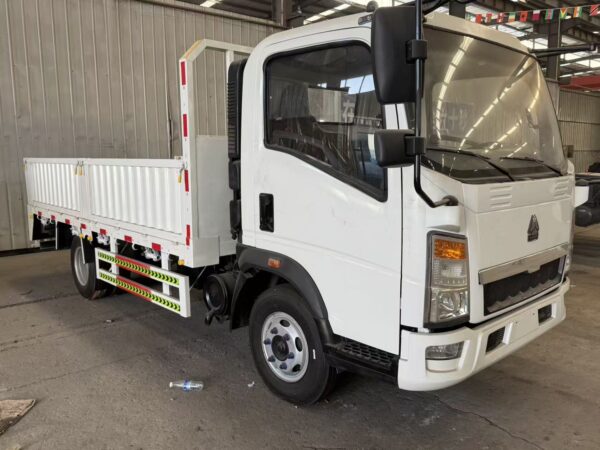 White SINOTRUK HOWO 4x2 light cargo truck front side view for sale - HICA Vehicle