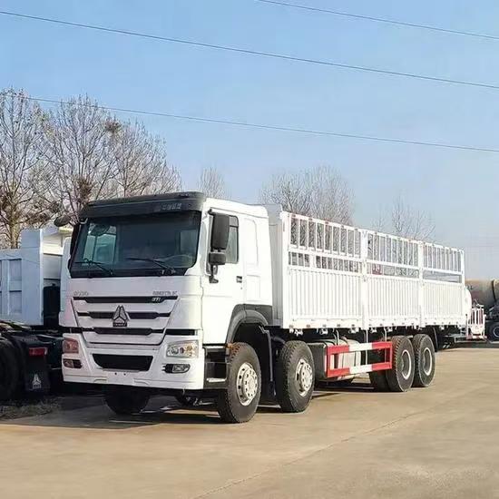 SINOTRUK HOWO 8x4 cargo truck with 371HP WD615 engine and high stake fence cargo body