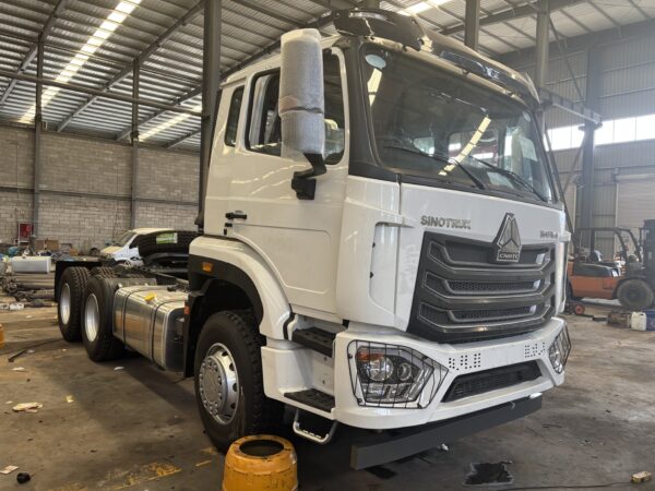 Spacious sleeper berth and interior storage space inside SINOTRUK HOWO NX 6x4 tractor truck cabin