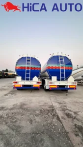 Rear view of 3-axle fuel tanker semi-trailer with access ladders and safety bumpers by HICA AUTO