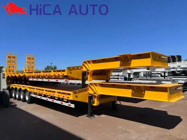 Yellow 4-axle hydraulic gooseneck lowbed semi-trailer with folding ramps for heavy equipment haulage