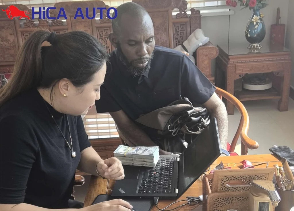 Mali client placing cash deposit for HOWO dump truck order at HICA AUTO office