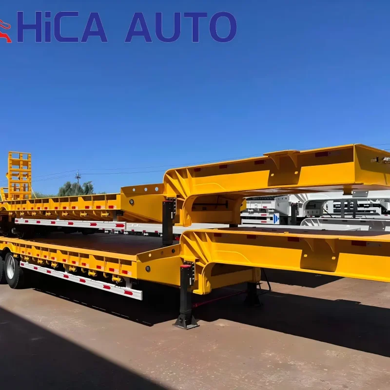 Yellow 4-axle hydraulic gooseneck lowbed semi-trailer with folding ramps for heavy equipment haulage